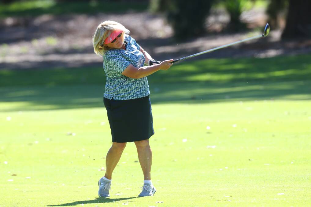 On the course: Windsor's Vickie Smith plays a shot down the fairway. Picture: Geoff Jones.