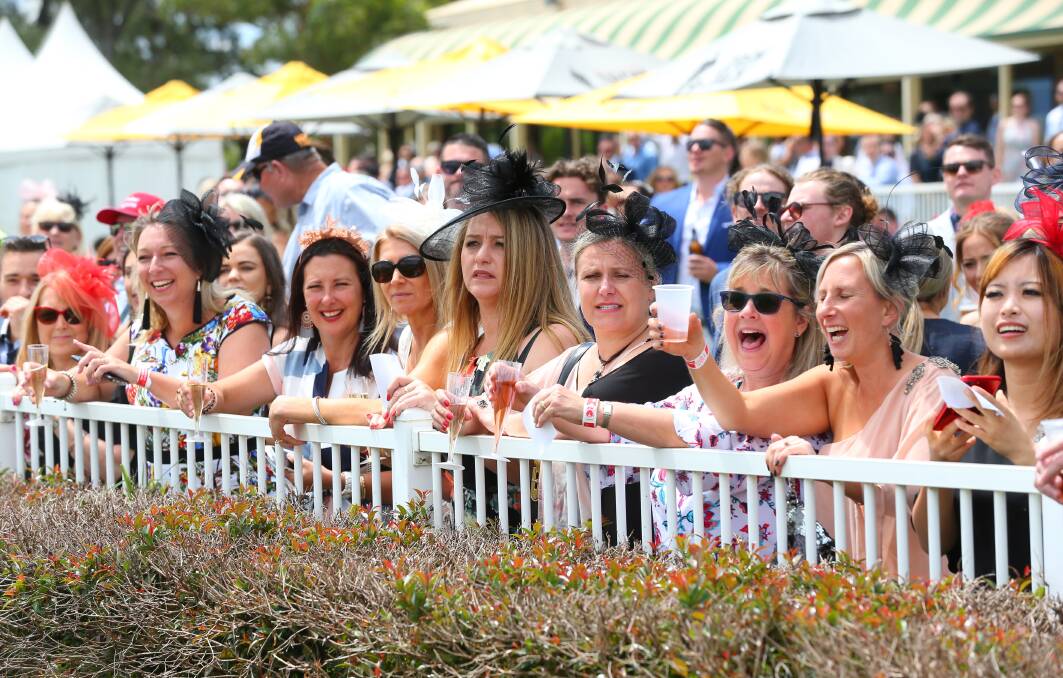 Packed out: Attendees of last year's Lander Toyota Ladies Day at Hawkesbury Race Club. Everyone is all dressed up as they line the fence, beside the Lawn Marquee, as they watch some of the top races of the day, November 8, 2018. Picture: Geoff Jones.