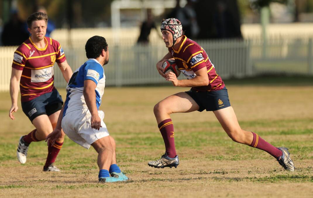 Local rivals: HAC's Luke Sproats takes the ball into the Hawkesbury Valley defensive line in a man-of-the-match performance. Picture: Geoff Jones.