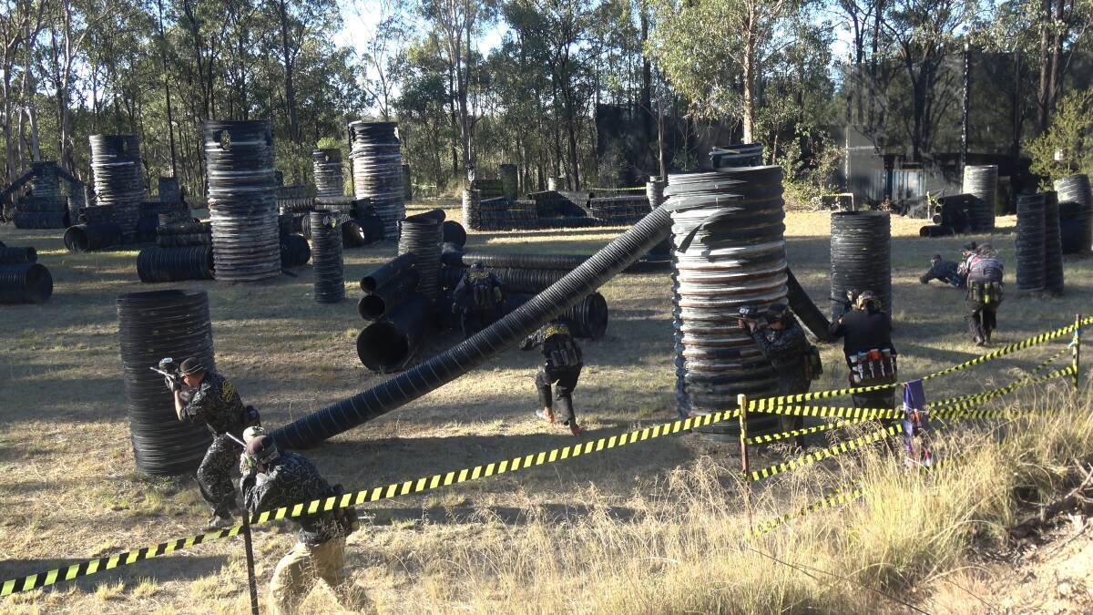 Action: One team sets off in a match at Action Paintball Games Yarramundi. Picture: Supplied.