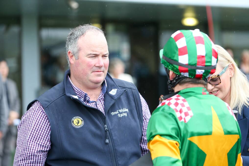 Winner: Brad Widdup speaking to jockey Mitchell Bell after riding Rare Episode to a win. Photo: Adam McLean.