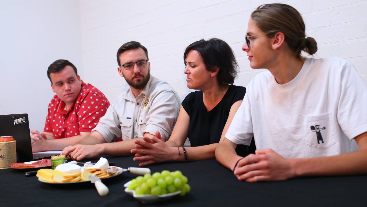 Talking beer: From left, Finn Coleman and our trio of panelists Cillian Coleman, Krystyna Pollard and Taylor Mattes discuss the first part of the Gazette's 12 Beers of Christmas series. Picture: Geoff Jones