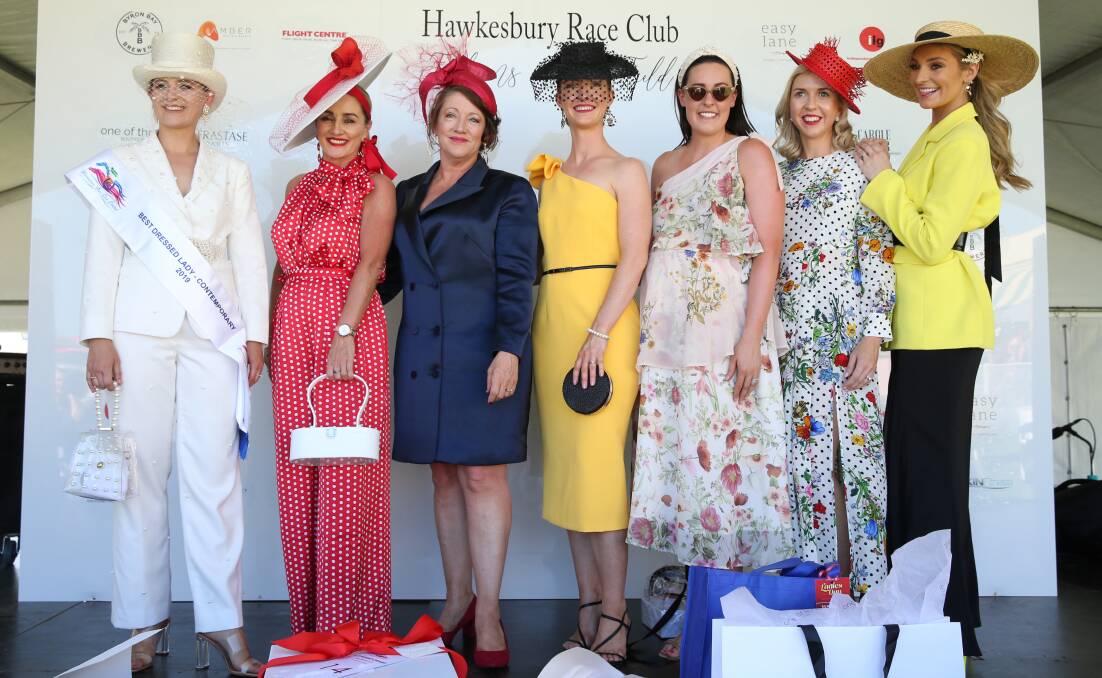Fashionistas: The winners, judges and host at the Fashions on the field competition. Picture: Geoff Jones