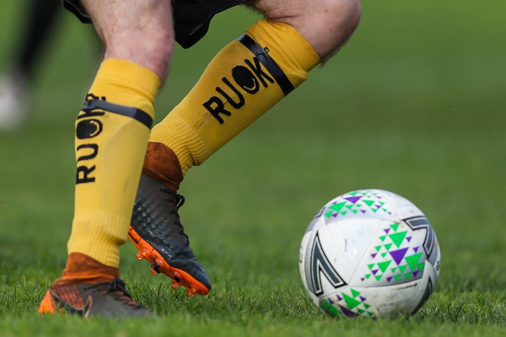 Support: A soccer player wears R U OK? socks to support the organisation. Picture: Morgan Hancock. 