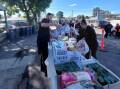 Milestones Early Learning Pitt Town and Papilio Early Learning Pitt Town volunteers hand out packed grocery items for flood affected families in the area. 