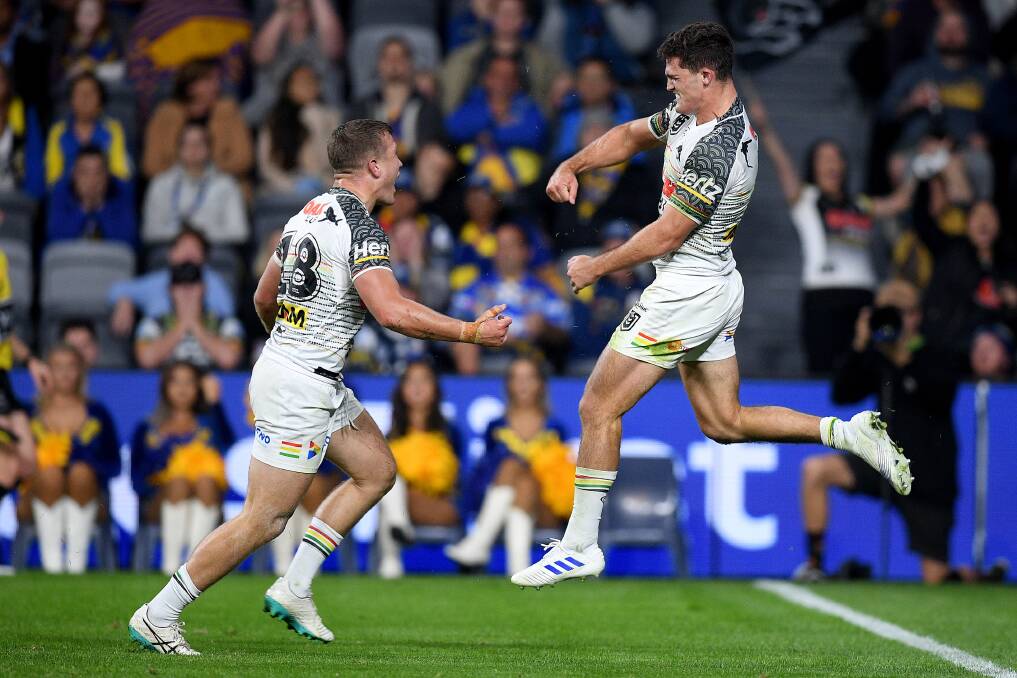 On Debut: Mitch Kenny (left) celebrates after Nathan Cleary scores a second half try to win the game. Pictures: Dan Himbrechts/AAP