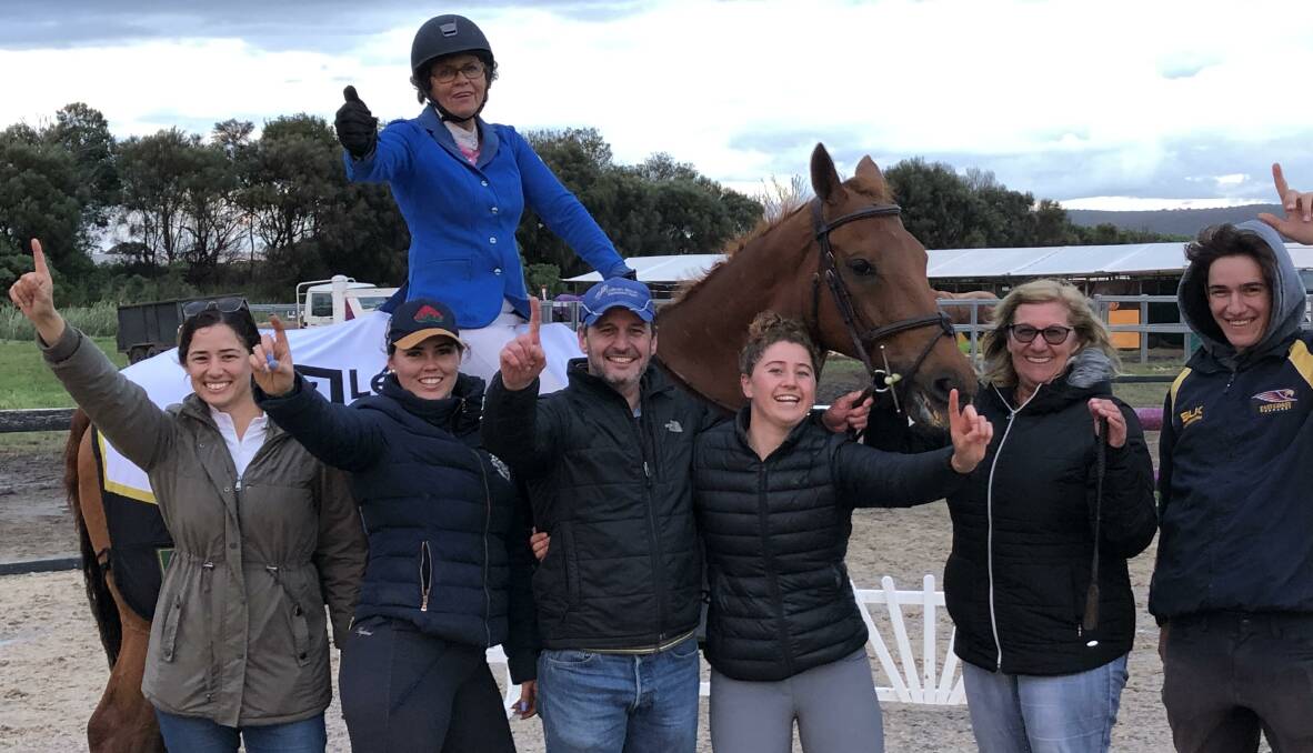 Winner: Colleen Brook on Buddy with (left to right) student Michelle Spiteri, daughter Liz Koob, Buddy's owner Stuart Cureton, student Lucy Evans and her mother Vicki Evans, and student Tom Grove. Picture: Stuart Cureton 