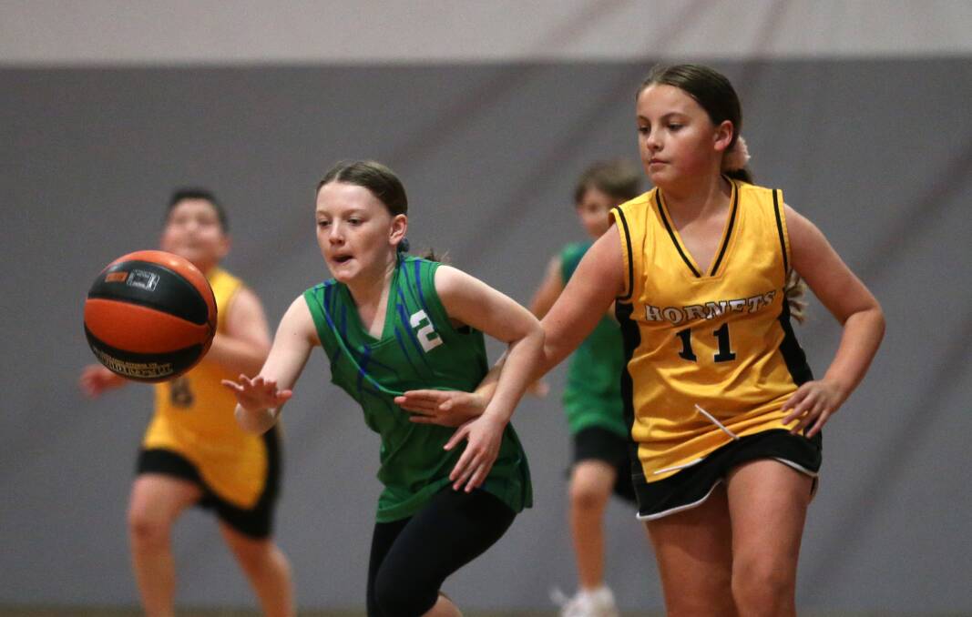 On court: Players fight for possession during an Under 12's match between the Hornets and the River Hawks at Hawkesbury PCYC. Picture: Geoff Jones.