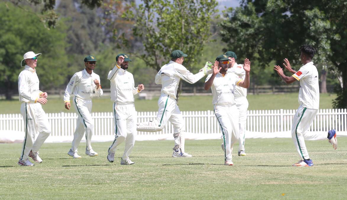 Wicket: Hawkesbury Cricket Club's First Grade celebrate the wicket taken by Austin Philip against Penrith at Owen Earle Oval. Picture: Geoff Jones