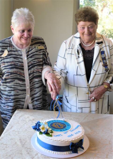 BIRTHDAY TREAT: State vice-president Annie Kiefer and Kurrajong branch president Wendy Dunston cut the cake made by member Kay Quinton.