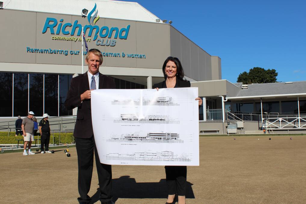 Chairman Geoff Luscombe and Group CEO Kimberley Talbot with a 1995 version of the plans, on the site where the hotel will go.