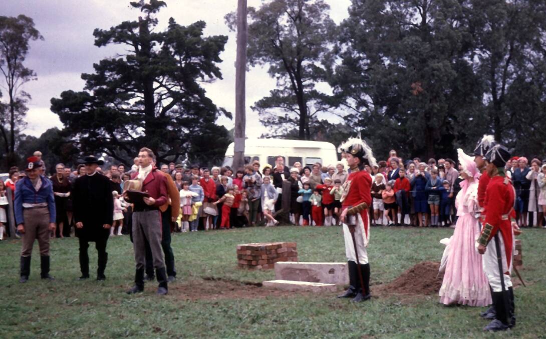 50 years ago: The re-enactment of Governor Macquarie laying the foundation stone, at the 150th anniversary celebrations in 1967, in the paddock where the parish centre is now. Photo: Beverley Hunt.