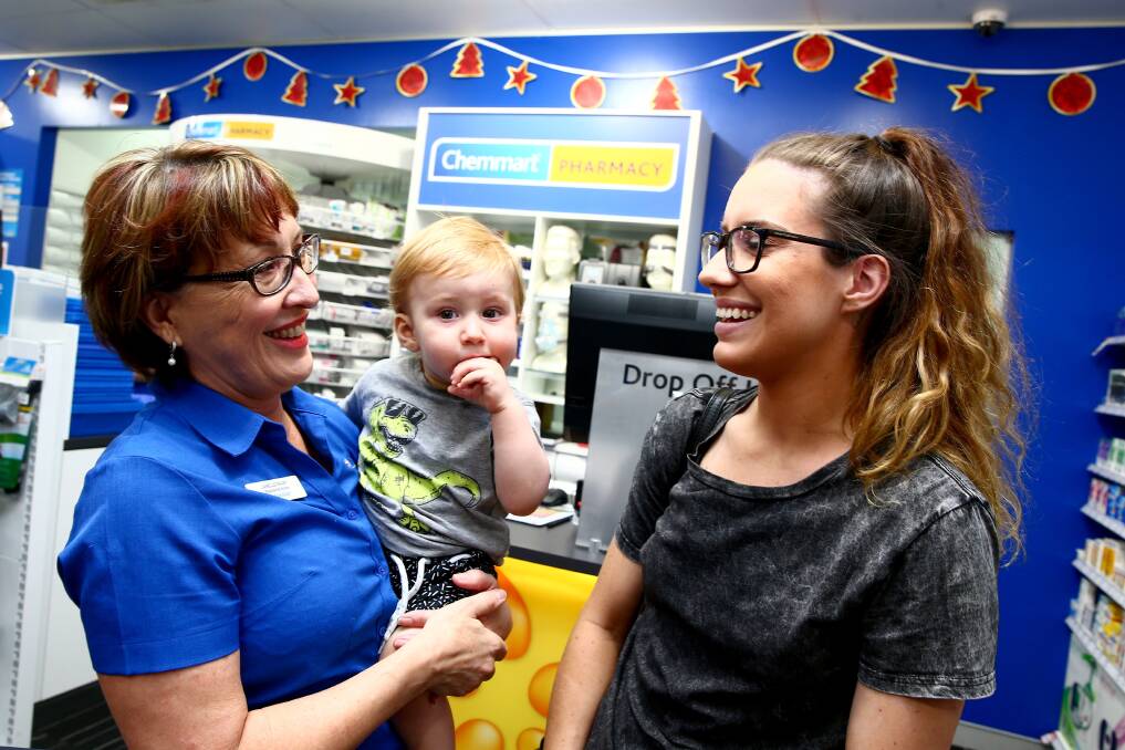 Tresillian nurse Janelle Daly with Lucinda Seckold and Carter, 1 at Chemmart North Richmond on December 2.