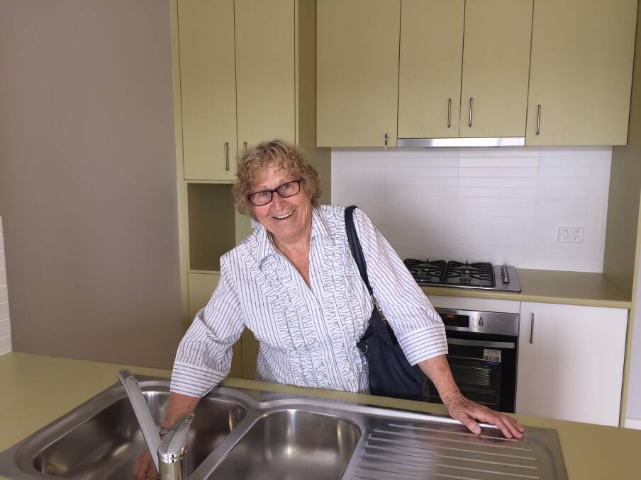 May checks out her new kitchen. 
