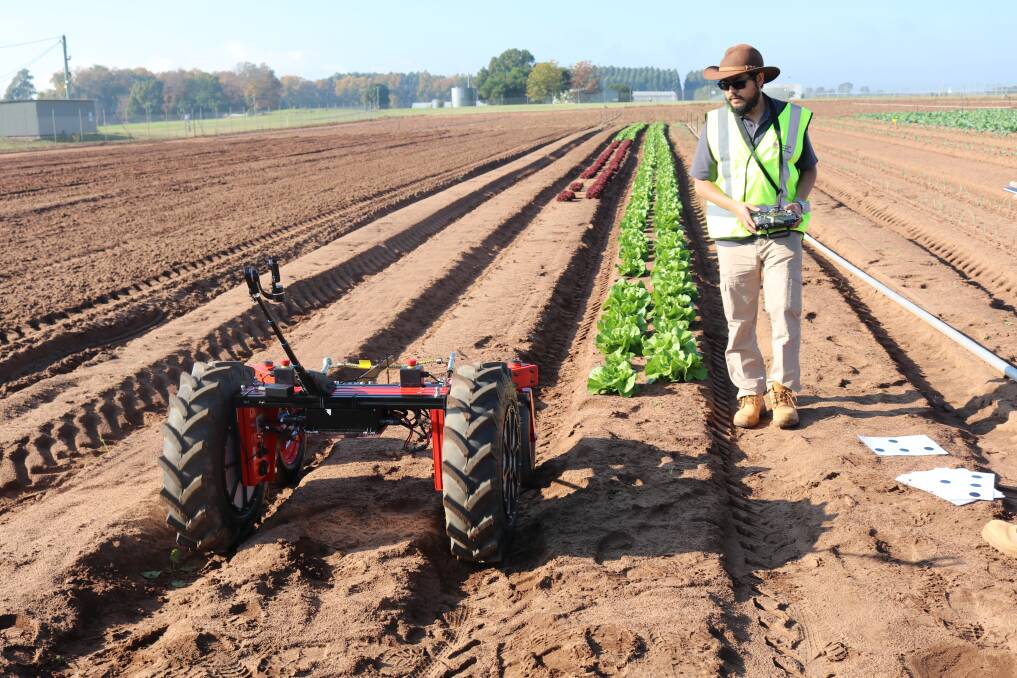 Javier Martinez of the ACFR operates the prototype robot at Richmond WSU's paddock on Southee Road.