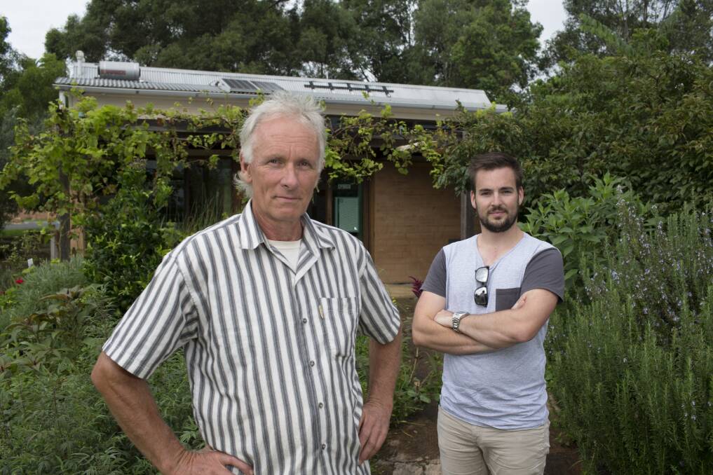 Eric Brocken and geochemistry student James Robinson at Hawkesbury EarthCare Centre, Richmond, which is open for Sustainable House Day. Picture: Geoff Jones