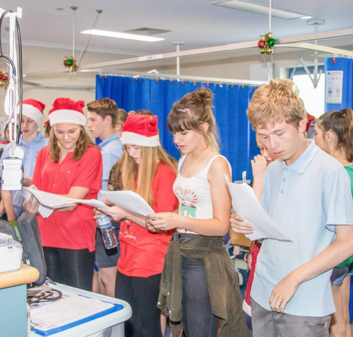Students strike up a song in the emergency department. 