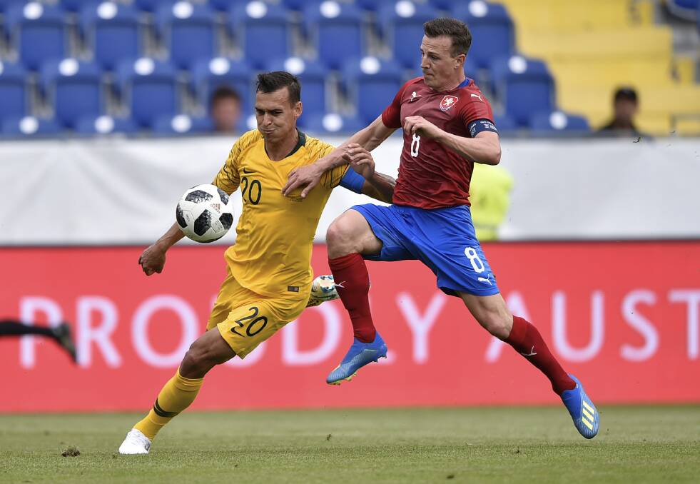 Action from the Socceroos World Cup friendly win over Czech Republic. Pictures:  Lubos Pavlicek and Christian Bruna /AP