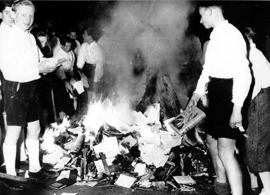 Hitler Youth members burning books in 1938. Picture: Getty Images