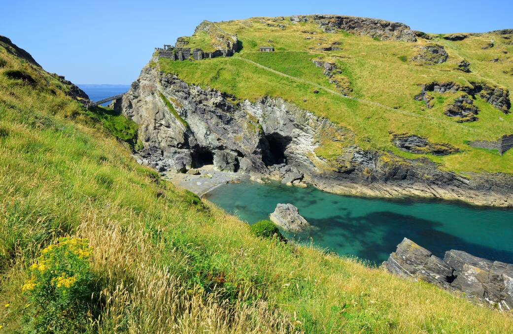 Tintagel Bay with the ruins of the castle in the background, where the author got vertigo. Picture: Shutterstock