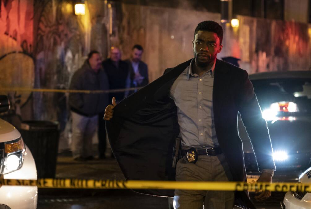 Different role: Chadwick Boseman loses the vibranium suit to play detective Andre Davis in new crime drama 21 Bridges, rated MA15+, in cinemas now.