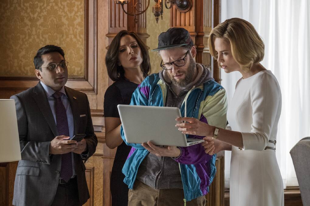 Hard at work: Speechwriter Fred Flarsky (Seth Rogen) works with Secretary of State Charlotte Field (Charlize Theron) alongside Maggie (June Diane Raphael) and Tom (Ravi Patel) in Long Shot, rated M, in cinemas now.