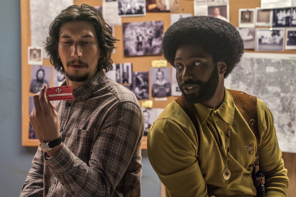 Strange but true: Adam Driver and John David Washington play two cops who form one identity to infiltrate the Ku Klux Klan in BlacKkKlansman, rated MA15+, in cinemas now.