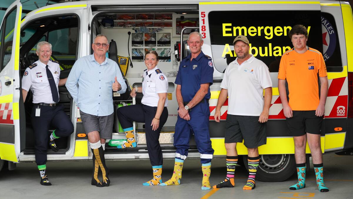 NSW Ambulance Commissioner Dominic Morgan, Jeff Tougher, Jade Marks and Matt Sterling from NSW Ambulance and Steven's uncle Luke Dawson, and nephew Ben Shepherd. Picture by Adam McLean