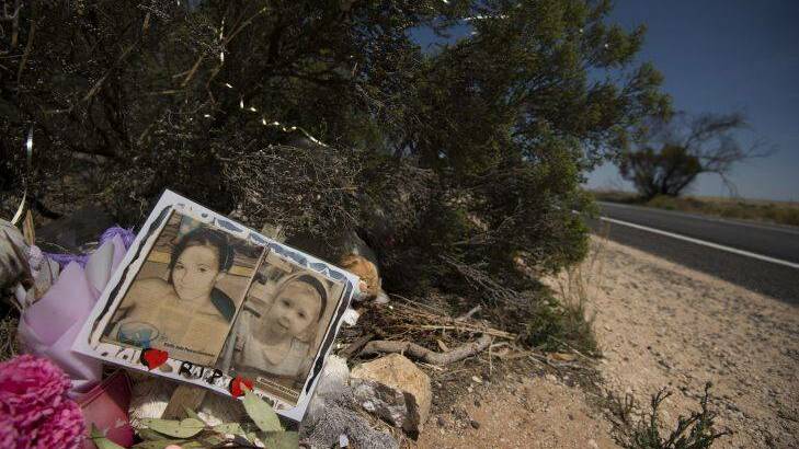 A memorial to Karlie Pearce-Stevenson and her daughter Khandalyce Pearce at the roadside, near Wynarka, South Australia, where Khandalyce's remains were found in a suitcase. Photo: Kate Geraghty