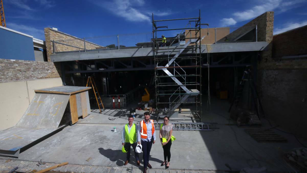 December opening: James Prowse (left) and Simon Johnston (Feros Group) and Kristy Paltridge (publicist) on the top level terrace of the new Highfield Caringbah. Picture Chris Lane