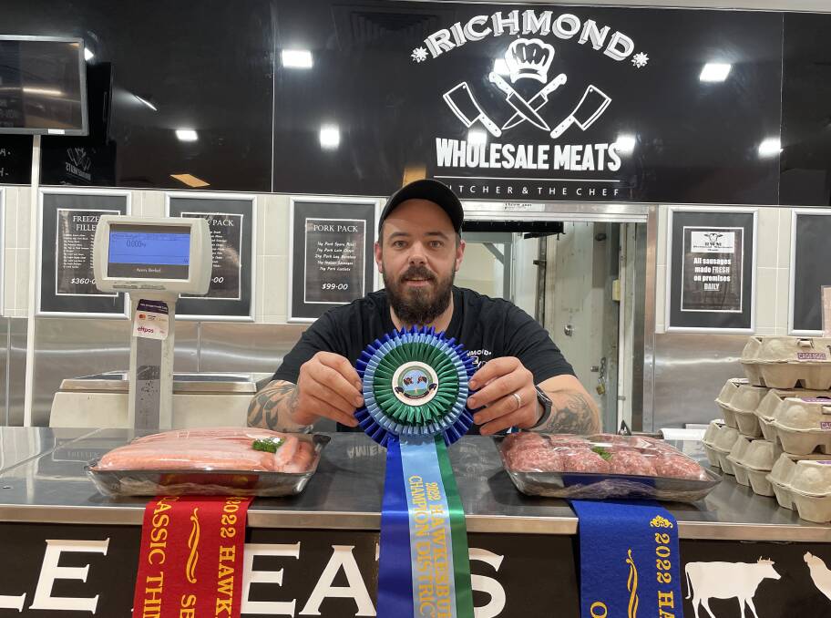 Damien Butler of Richmond Wholesale Meats with his ribbons and award-winning hamburger patties and sausages. Picture: Sarah Falson