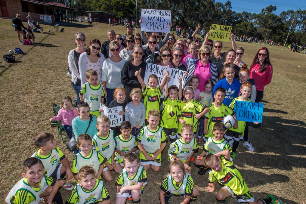 PLEASE LISTEN, KMART: A group of mums and their kids who want Kmart in the Hawkesbury gathered at Oakville Oval - where the kids play soccer - at the weekend. Picture: Geoff Jones