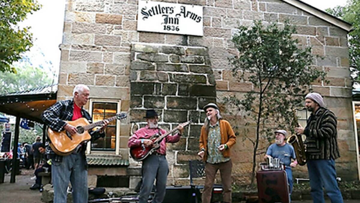 Music makers: St Albans Folk Festival committee member Graham Black's band BluesAngels, performing outside the historic Settlers Arms Inn during the festival. Picture: Supplied