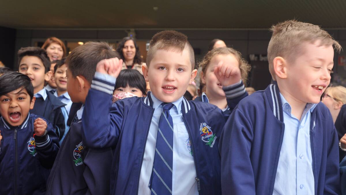 St Joseph's Primary Schofields pupils celebrate the opening of the school's new main building. Picture: Supplied