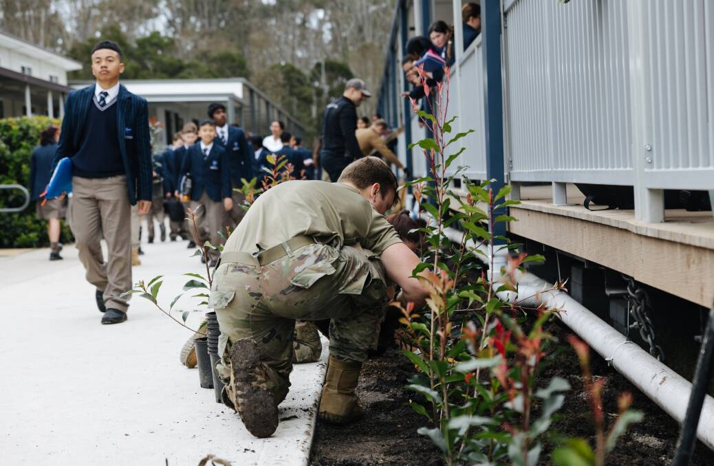 Members of the 353rd Special Operations Wing of the US Air Force helped pupils plant 160 new trees across the ACC Marsden Park campus as a "lived out example of genuine community service". Picture: Supplied