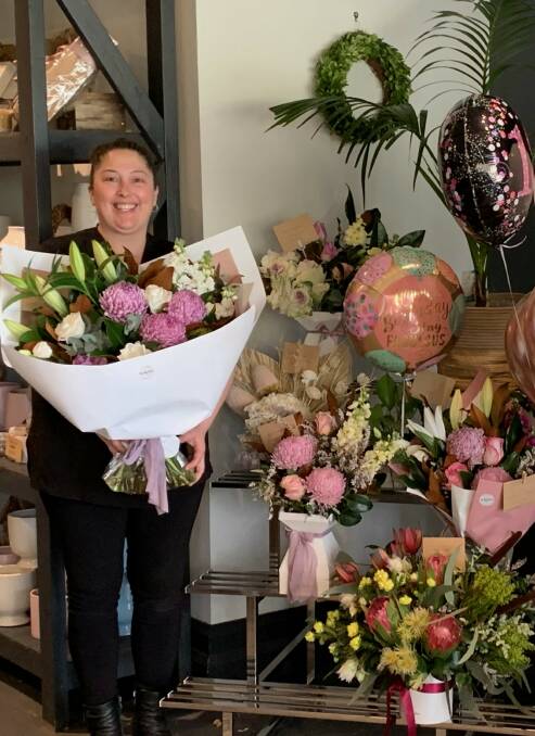 Joyous delivery: Jody Groth, owner of The Bloom Room florist at Richmond, ready to make some Hawkesbury residents very happy indeed with her fresh deliveries. Picture: Supplied