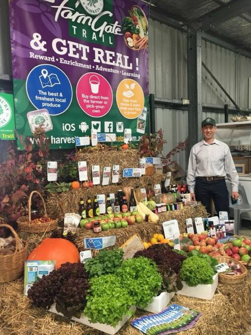 Local produce: Hawkesbury Harvest board members, Andrew Docking, at last years Hawkesbury Show in the Agriculture Pavilion. Picture: Supplied