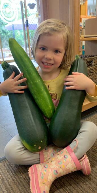 Green thumb: Alice of Fit Kidz Learning Centre Vineyard with some home grown vegetables. Picture: Supplied