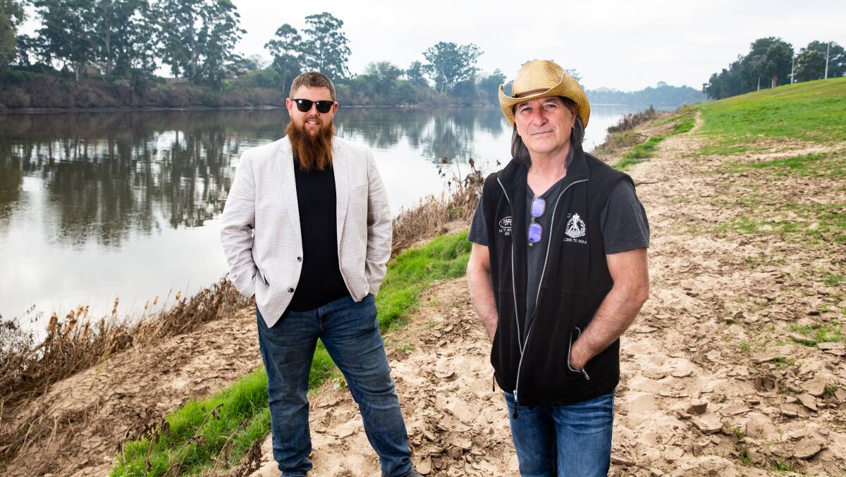 Organisers: Jarryd Faint and Dave Wilkins, at Governor Phillip Park on the Hawkesbury River, Windsor, where the concert will be held on June 6. Picture: Geoff Jones