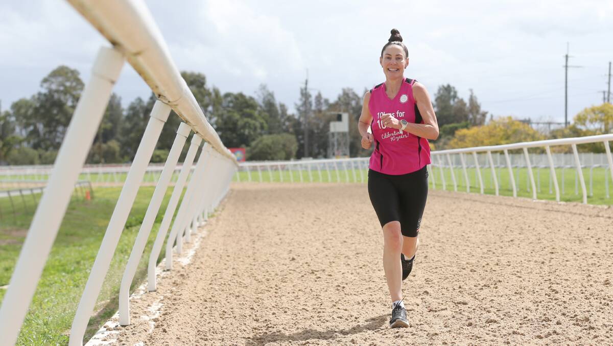 Hitting the track: Pink Finss founder Jodie Amor during last year's challenge, running at the Hawkesbury Race Club in Clarendon. Picture: Geoff Jones