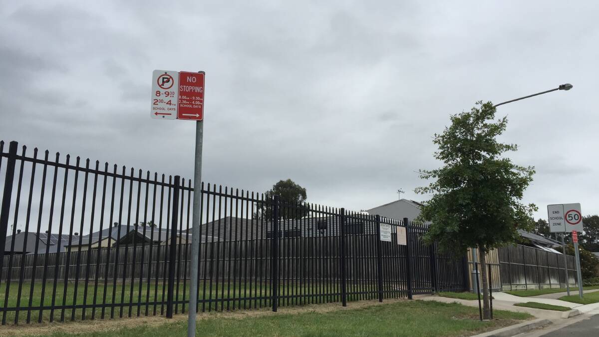 The newly-erected No Parking and No Stopping signs behind Pitt Town Public School. Picture: Sarah Falson