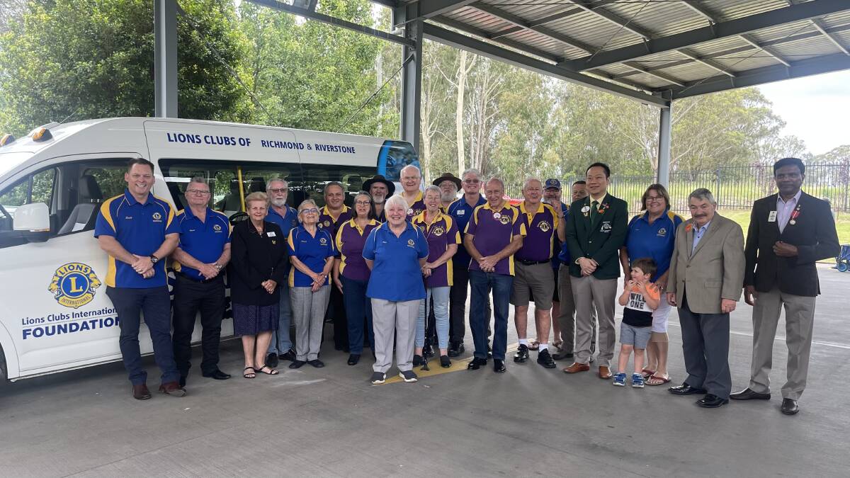 Lions Clubs of Richmond and Riverstone, and Lions Clubs International Foundation members, with the modified Toyota Hiace they donated to South Creek School in Riverstone. Picture by Sarah Falson