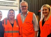 Many hands: (L-R) Jenny Morrison, Hawkesbury's Helping Hands co-founder Linda Strickland, Prime Minister Scott Morrison, and Hawkesbury Councillor Sarah Richards. Picture: Hawkesbury's Helping Hands/Facebook