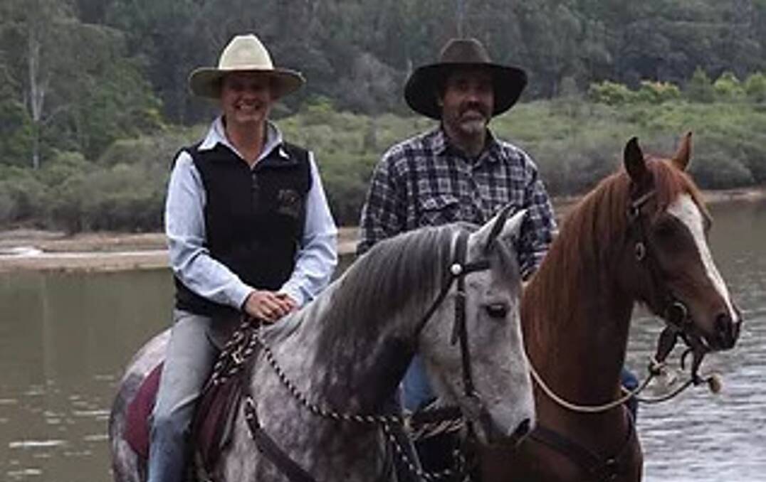 Suzi and Corey on horseback before the floods, in the St Albans Common near the lake. In the background is where they found the ashes. Picture: Supplied