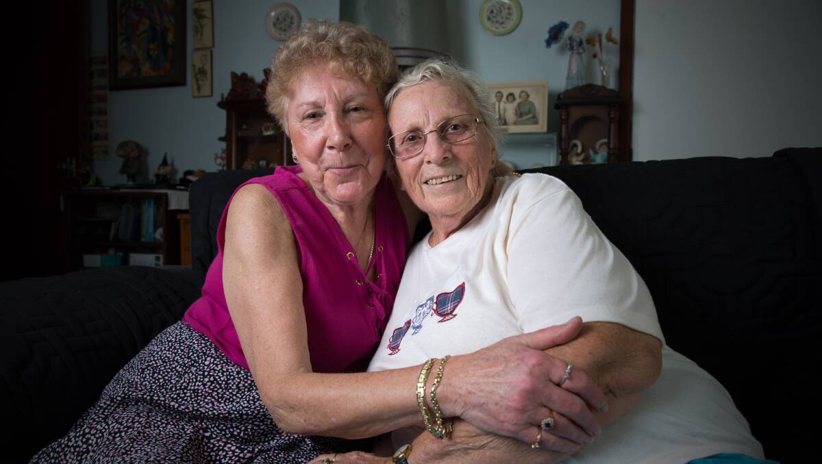 Reunited: Long lost sisters Anne Whitney (maroon) and June 'Marie' Reid at Marie's South Windsor home in 2018, after having reunited following over 70 years of estrangement. Picture: Geoff Jones