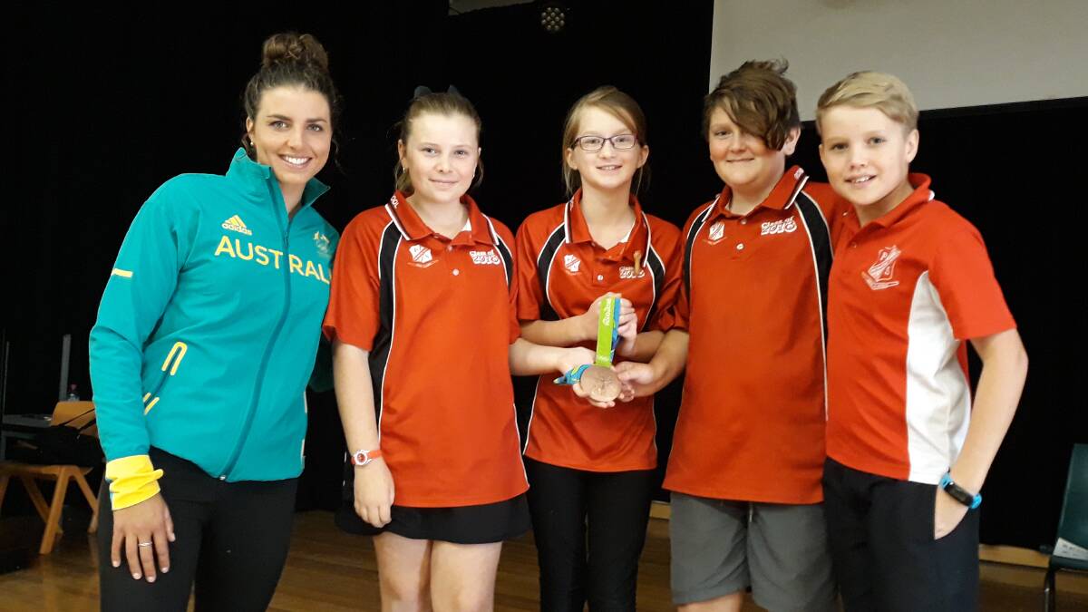 INSPIRING: Jessica Fox sharing her medal with Richmond North PS students: Ella, Paige, Bradley and Ryan. Picture: Supplied