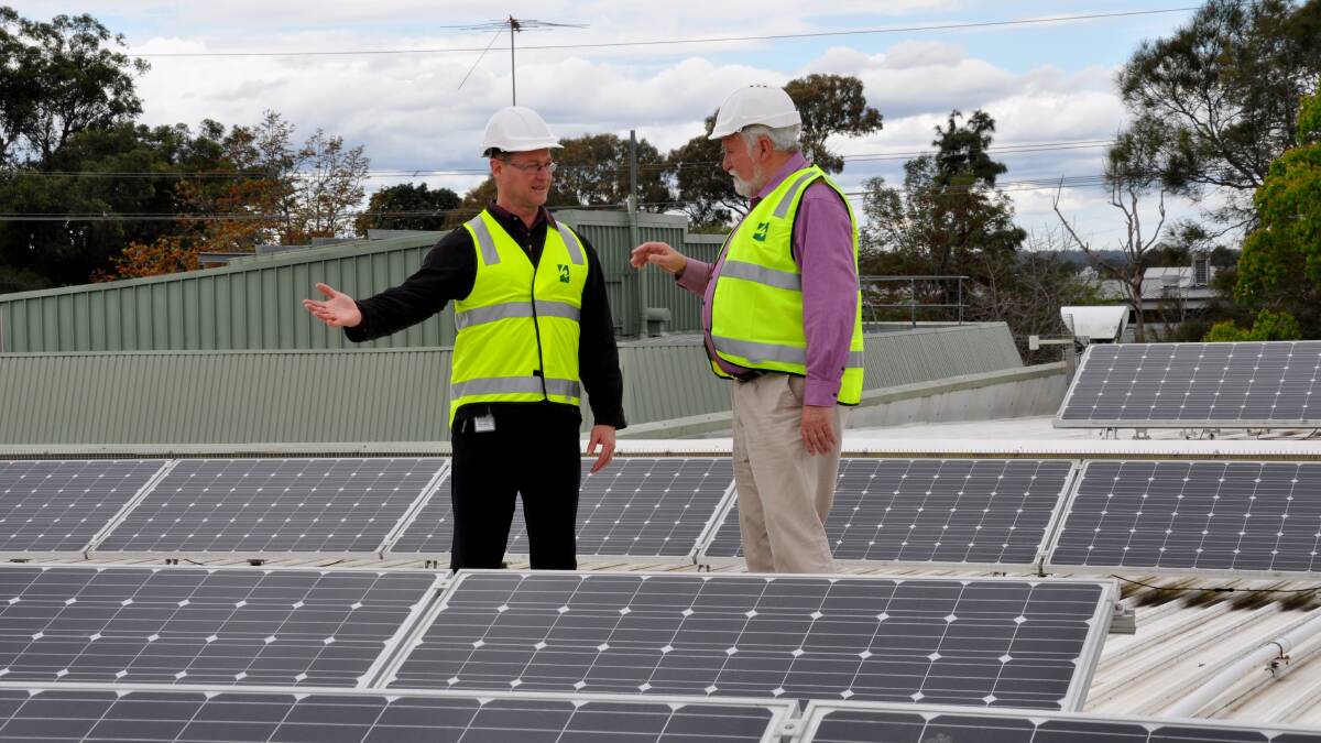 SOLAR PROJECT: The Mayor of Hawkesbury, Councillor Barry Calvert (right) discusses the solar program with Building Services Coordinator Mark White during a site visit of existing rooftop solar panels. Picture: Supplied