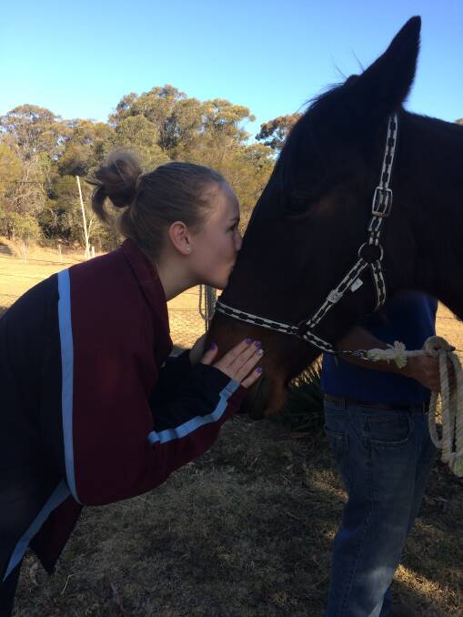 Rescued: Hope Beetson with one of her rescue horses, George.