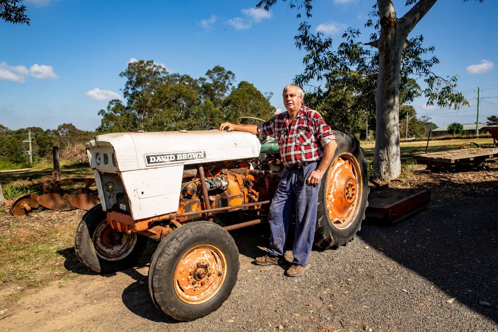 Revving up: Lindsay Brown of East Kurrajong with an antique tractor, such is the type that will be displayed at the Hobby and Motor Show at East Kurrajong. Picture: Geoff Jones