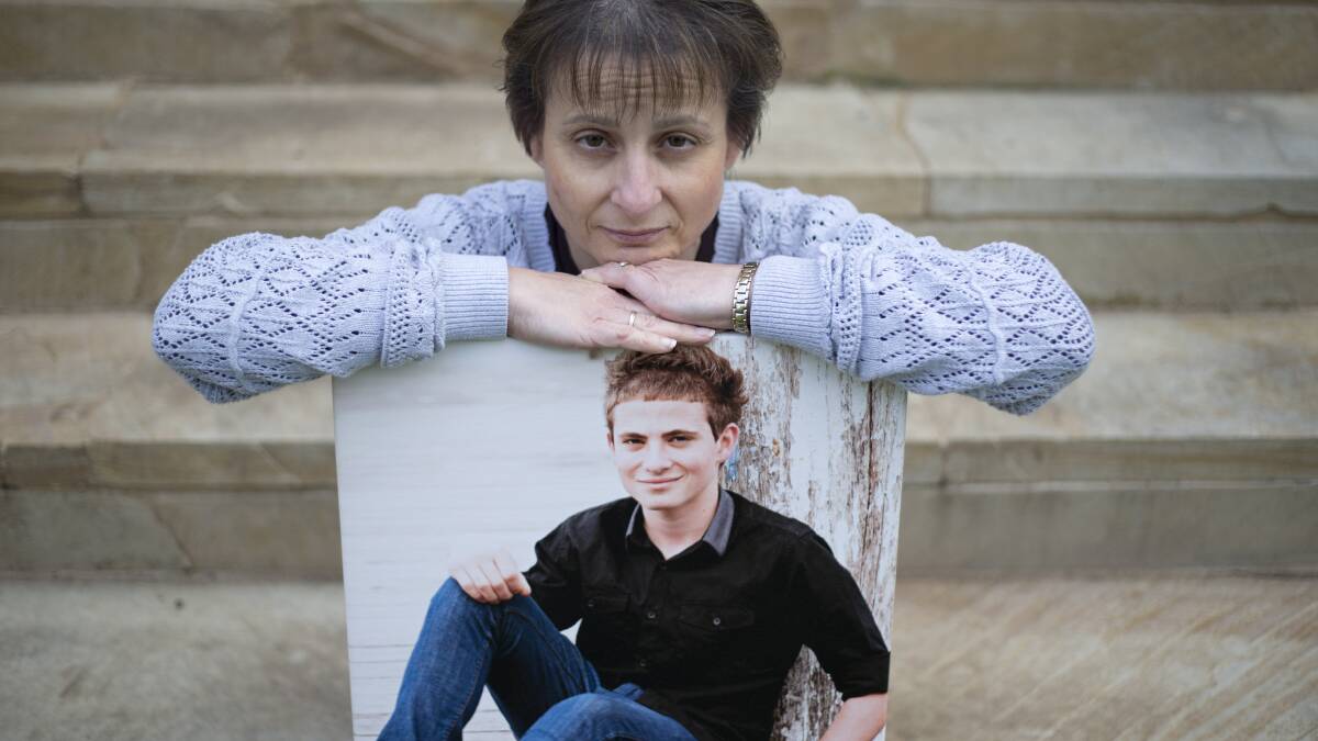KEEP THEM SAFE: Colleen Vassallo with a picture of her late son Philip at her Berkshire Park home. Picture: Geoff Jones